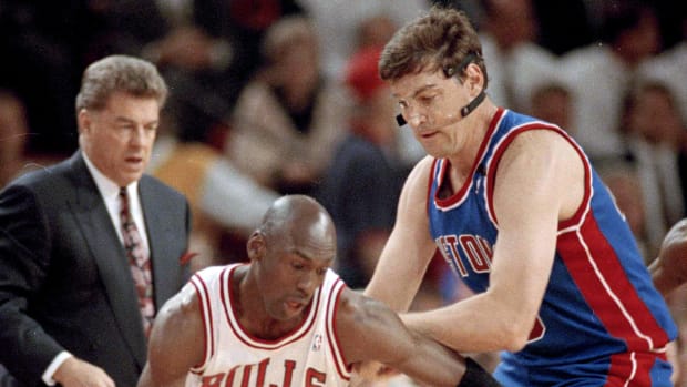 Video Surfaces Of Michael Jordan Throwing A Right Cross To Bill Laimbeer, Who Quickly Runs Away