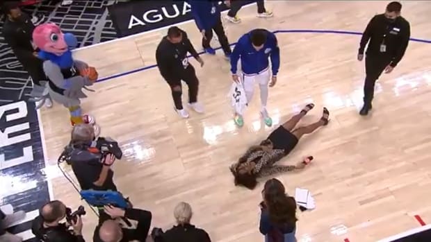 Clippers Sideline Reporter Kristina Pink Slips and Falls On Court After Postgame Interview