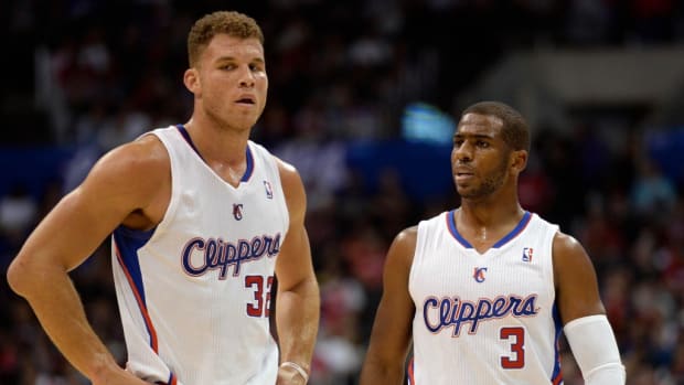 Los Angeles Clippers Blake Griffin dunks the ball by Boston Celtics Jordan  Crawford during first half action in Los Angeles on January 8, 2014. The  Clippers lead the Celtics at halftime 59-55.