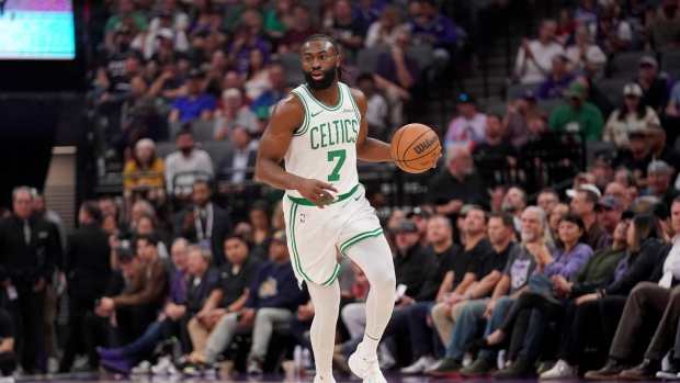 Sacramento, California, USA; Boston Celtics forward Jaylen Brown (7) dribbles the ball against the Sacramento Kings in the first quarter at the Golden 1 Center. Mandatory Credit: Cary Edmondson-Imagn Images