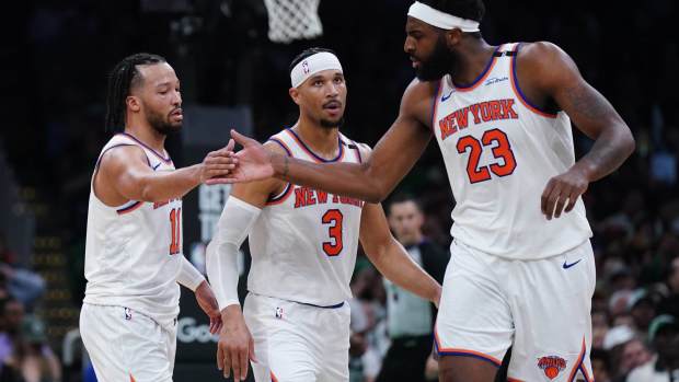 May 7, 2025; Boston, Massachusetts, USA; New York Knicks guard Jalen Brunson (11) and center Mitchell Robinson (23) react after a play against the Boston Celtics in the second half during game two of the second round for the 2025 NBA Playoffs at TD Garden.