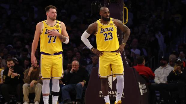 Los Angeles Lakers guard Luka Doncic (77) and forward LeBron James (23) during the second quarter against the Minnesota Timberwolves at Crypto.com Arena.