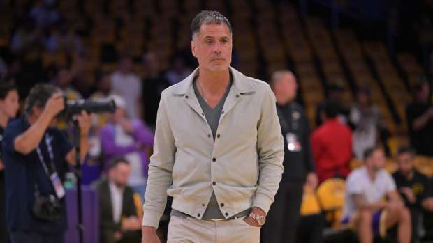 Los Angeles Lakers general manager Rob Pelinka walks on the couet prior to the game against the Minnesota Timberwolves at Crypto.com Arena.