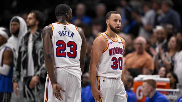 Dallas, Texas, USA; Golden State Warriors forward Draymond Green (23) and guard Stephen Curry (30) during the game between the Dallas Mavericks and the Golden State Warriors at the American Airlines Center. Mandatory Credit: Jerome Miron-Imagn Images