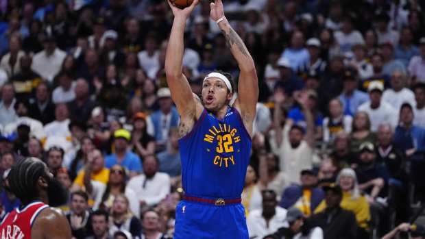 Denver, Colorado, USA; Denver Nuggets forward Aaron Gordon (32) shoots a three-pointer in the third quarter against the LA Clippers during game seven of the first round for the 2025 NBA Playoffs at Ball Arena. Mandatory Credit: Ron Chenoy-Imagn Images