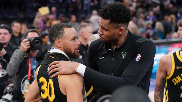 Mar 6, 2024; San Francisco, California, USA; Milwaukee Bucks forward Giannis Antetokounmpo (34) and Golden State Warriors guard Stephen Curry (30) meet after the game at the Chase Center.
