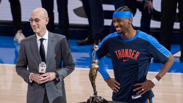 May 22, 2025; Oklahoma City, Oklahoma, USA; NBA commissioner is Adam Silver presents Oklahoma City Thunder guard Shai Gilgeous-Alexander (2) with the Michael Jordan Trophy for winning the most valuable player award for the 2024-25 season before game two of the western conference finals for the 2025 NBA Playoffs at Paycom Center.