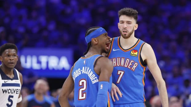 May 22, 2025; Oklahoma City, Oklahoma, USA; Oklahoma City Thunder guard Shai Gilgeous-Alexander (2) and forward Chet Holmgren (7) celebrate after a play against the Minnesota Timberwolves in the third quarter during Game 2 of the Western Conference Finals for the 2025 NBA Playoffs at Paycom Center.