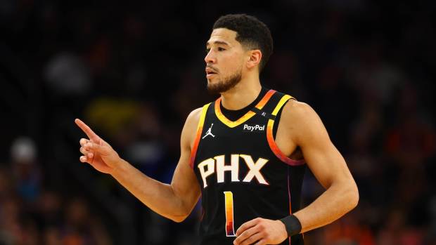 Apr 9, 2025; Phoenix, Arizona, USA; Phoenix Suns guard Devin Booker (1) reacts after a play against the Oklahoma City Thunder during the first half at Footprint Center. Mandatory Credit: Mark J. Rebilas-Imagn Images