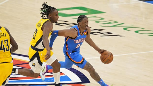 Jun 8, 2025; Oklahoma City, Oklahoma, USA; Oklahoma City Thunder forward Jalen Williams (8) dribbles the ball against Indiana Pacers forward Aaron Nesmith (23) during the second half during game two of the 2025 NBA Finals at Paycom Center. Mandatory Credit: Kyle Terada-Imagn Images