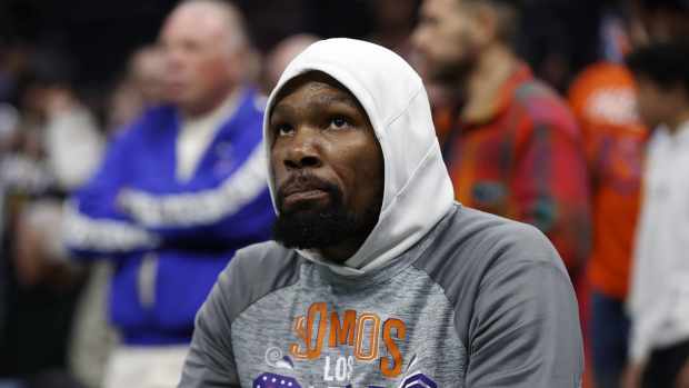 Phoenix Suns forward Kevin Durant (35) sits on the bench prior to the start of the game against the Charlotte Hornets at Spectrum Center.