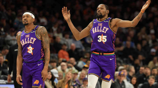 Mar 14, 2025; Phoenix, Arizona, USA; Phoenix Suns forward Kevin Durant (35) reacts alongside Bradley Beal (3) against the Sacramento Kings at Footprint Center. Mandatory Credit: Mark J. Rebilas-Imagn Images
