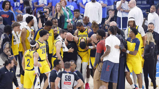 Jun 22, 2025; Oklahoma City, Oklahoma, USA; Indiana Pacers guard Tyrese Haliburton (0) is assisted after an apparent injury following a play against the Oklahoma City Thunder during the first half of game seven of the 2025 NBA Finals at Paycom Center. Mandatory Credit: Alonzo Adams-Imagn Images