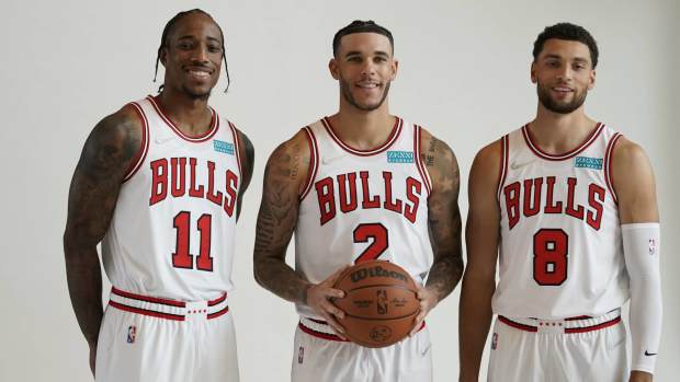 Chicago, Illinois, USA; Chicago Bulls guard Zach LaVine (8), forward DeMar DeRozan (11), and guard Lonzo Ball (2) pose for photos during Chicago Bulls Media Day at the United Center. Mandatory Credit: David Banks-Imagn Images