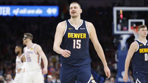 Denver Nuggets center Nikola Jokic (15) smiles after a play against the Oklahoma City Thunder during the second half at Paycom Center.
