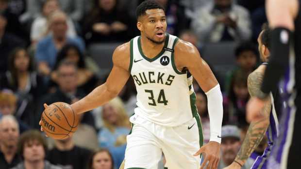 Sacramento, California, USA; Milwaukee Bucks forward Giannis Antetokounmpo (34) dribbles against the Sacramento Kings during the first quarter at Golden 1 Center. Mandatory Credit: Darren Yamashita-Imagn Images