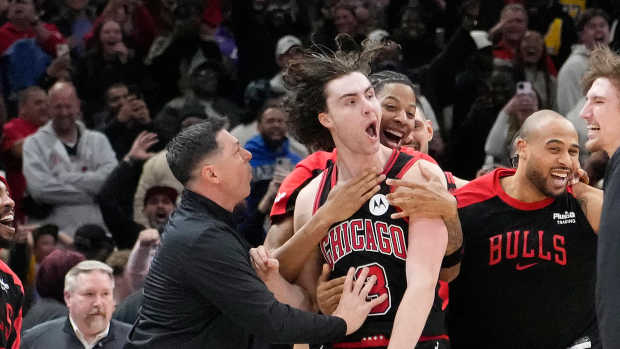 Chicago, Illinois, USA; Chicago Bulls guard Josh Giddey (3) celebrates with teammates after making the game-winning three-point basket against the Los Angeles Lakers during the second half at United Center. Mandatory Credit: David Banks-Imagn Images