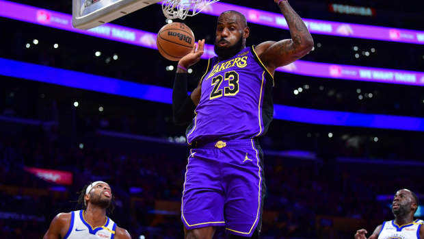 Los Angeles Lakers forward LeBron James (23) dunks for the basket against the Golden State Warriors during the first half at Crypto.com Arena.