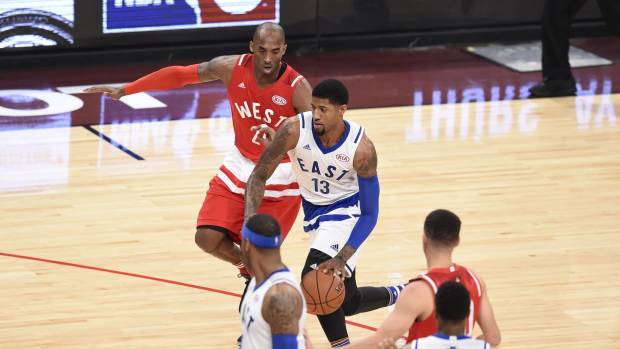 Feb 14, 2016; Toronto, Ontario, CAN; Eastern Conference forward Paul George of the Indiana Pacers (13) dribbles the ball in front of Western Conference forward Kobe Bryant of the Los Angeles Lakers (24) in the second quarter during the NBA All Star Game at Air Canada Centre. Mandatory Credit: Peter Llewellyn-Imagn Images