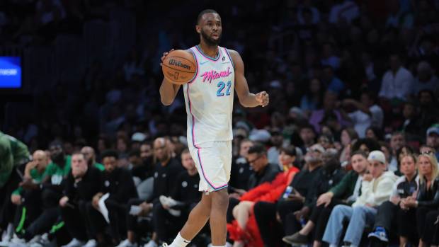 Miami Heat forward Andrew Wiggins (22) dribbles the basketball against the Boston Celtics during the second quarter at Kaseya Center.