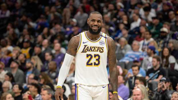 Dec 21, 2024; Sacramento, California, USA; Los Angeles Lakers forward LeBron James (23) smiles after his team scored against the Sacramento Kings during the fourth quarter at Golden 1 Center.