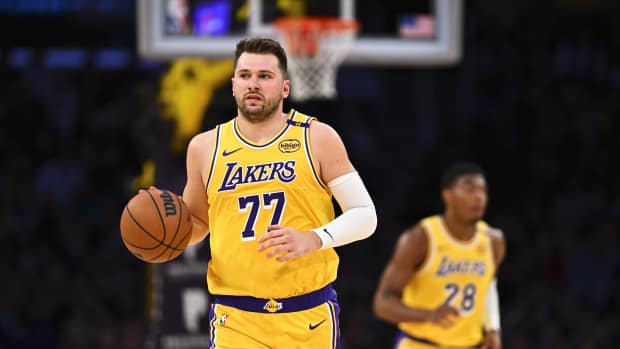 Los Angeles, California, USA; Los Angeles Lakers guard Luka Doncic (77) moves the ball against the Houston Rockets during the first half at Crypto.com Arena. Mandatory Credit: Jonathan Hui-Imagn Images