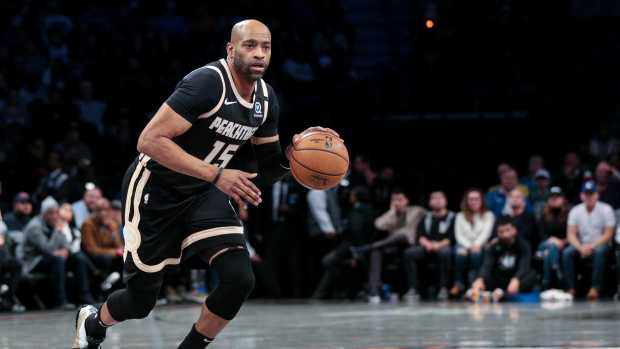 Brooklyn, New York, USA; Atlanta Hawks guard Vince Carter (15) dribbles up court during the second quarter against the Brooklyn Nets at Barclays Center. Mandatory Credit: Vincent Carchietta-Imagn Images