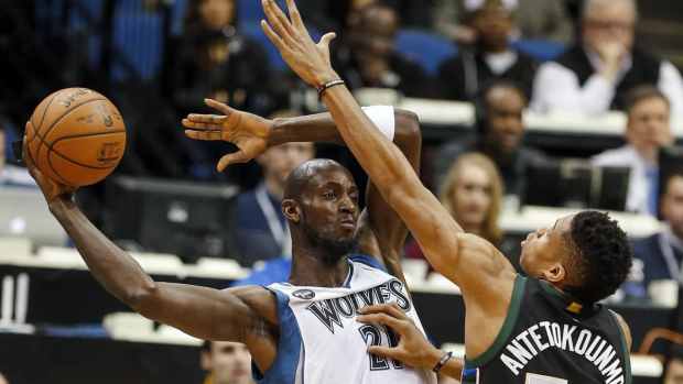 Jan 2, 2016; Minneapolis, MN, USA; Minnesota Timberwolves forward Kevin Garnett (21) looks to pass as Milwaukee Bucks forward Giannis Antetokounmpo (34) defends him in the first quarter at Target Center. The Bucks win 95-85.