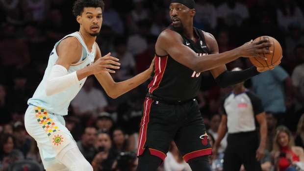 Jan 19, 2025; Miami, Florida, USA; Miami Heat center Bam Adebayo (13) looks to pass the ball as San Antonio Spurs center Victor Wembanyama (1) defends during the first half at Kaseya Center. Mandatory Credit: Jim Rassol-Imagn Images