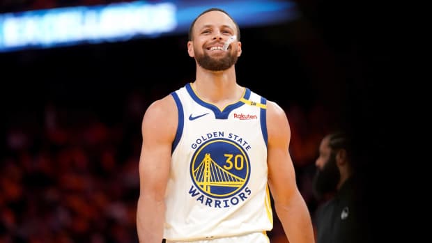 San Francisco, California, USA; Golden State Warriors guard Stephen Curry (30) smiles after making a basket against the Memphis Grizzlies in the fourth quarter at the Chase Center.