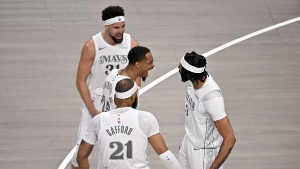Dallas, Texas, USA; Dallas Mavericks forward Anthony Davis (3) and guard Klay Thompson (31) and forward P.J. Washington (25), and center Daniel Gafford (21) celebrate after Davis dunks the ball during the game between the Dallas Mavericks and the Houston Rockets at the American Airlines Center.