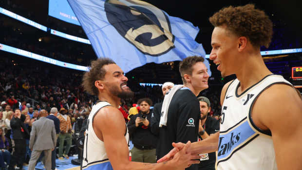 Dec 6, 2024; Atlanta, Georgia, USA; Atlanta Hawks guard Trae Young (11) celebrates with guard Dyson Daniels (5) after an overtime victory over the Los Angeles Lakers at State Farm Arena. Mandatory Credit: Brett Davis-Imagn Images  
