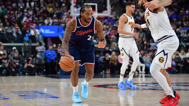 Apr 24, 2025; Inglewood, California, USA; Los Angeles Clippers forward Kawhi Leonard (2) moves the ball against Denver Nuggets guard Jamal Murray (27) during the second half of game three in the first round of the 2024 NBA Playoffs at Intuit Dome. Mandatory Credit: Gary A. Vasquez-Imagn