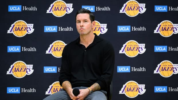 Sep 25, 2025; El Segundo, CA, USA; Los Angeles Lakers head coach JJ Redick, right, looks on during a press conference to preview the 2025-26 season at UCLA Health Training Center.