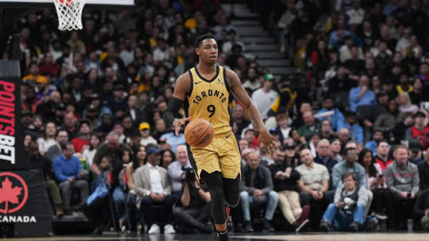 Apr 2, 2024; Toronto, Ontario, CAN; Toronto Raptors guard RJ Barrett (9) dribbles the ball up court against the Los Angeles Lakers during the third quarter at Scotiabank Arena.