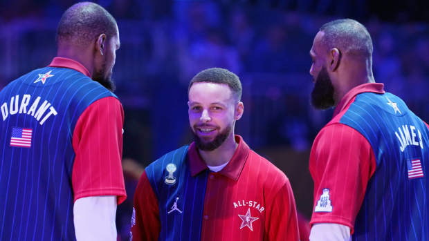 Western Conference guard Stephen Curry (30) of the Golden State Warriors talks with forward Kevin Durant (35) of the Phoenix Suns and forward LeBron James (23) of the Los Angeles Lakers before the 73rd NBA All Star game at Gainbridge Fieldhouse.Mandatory Credit: Kyle Terada-Imagn Images