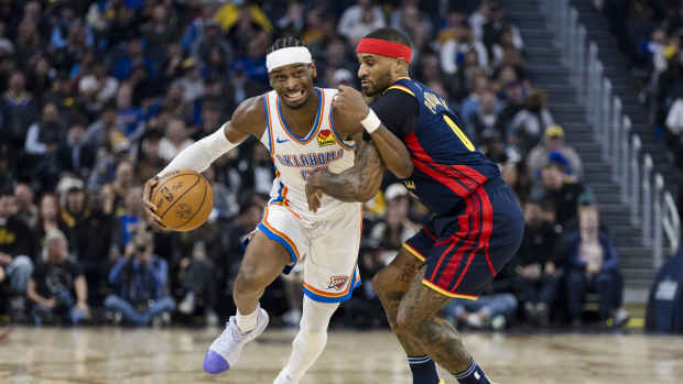 Nov 27, 2024; San Francisco, California, USA; Oklahoma City Thunder guard Shai Gilgeous-Alexander (2) rives past Golden State Warriors guard Gary Payton II (0) during the first half at Chase Center. Mandatory Credit: John Hefti-Imagn Images  