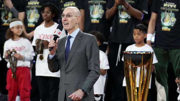 NBA commissioner Adam Silver presents the trophy to the Milwaukee Bucks after they won the Emirates NBA Cup championship game against the Oklahoma City Thunder at T-Mobile Arena.