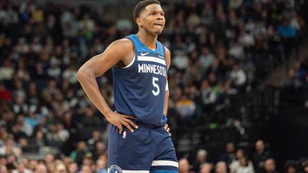 Dec 13, 2024; Minneapolis, Minnesota, USA; Minnesota Timberwolves guard Anthony Edwards (5) watches the Los Angeles Lakers shoot free throws in the second quarter at Target Center. Mandatory Credit: Matt Blewett-Imagn Images