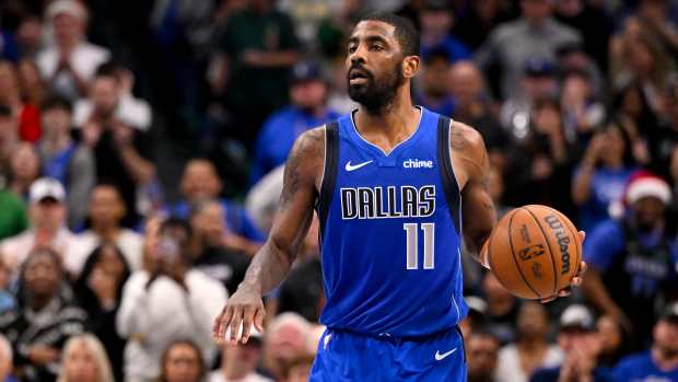 Dec 25, 2024; Dallas, Texas, USA; Dallas Mavericks guard Kyrie Irving (11) brings the ball up court against the Minnesota Timberwolves during the second half at the American Airlines Center. Mandatory Credit: Jerome Miron-Imagn Images  