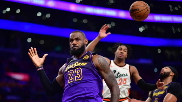 Los Angeles Lakers forward LeBron James (23) reacts after scoring a basket against the Detroit Pistons during the second half at Crypto.com Arena.