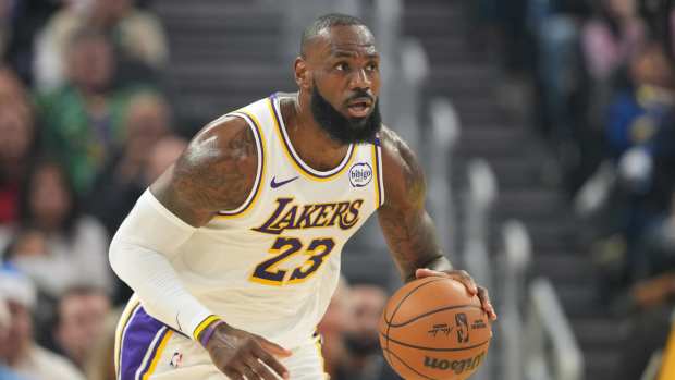 Los Angeles Lakers forward LeBron James (23) dribbles against the Golden State Warriors during the first quarter at Chase Center.