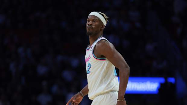 Miami Heat forward Jimmy Butler (22) looks on against the Denver Nuggets during the third quarter at Kaseya Center.