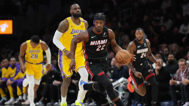  Miami Heat forward Jimmy Butler (22) intercepts a pass as Los Angeles Lakers forward LeBron James (23) trails the play in the first half at Kaseya Center. Mandatory Credit: Jim Rassol-Imagn Images