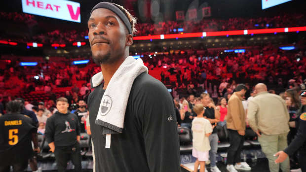 Miami Heat forward Jimmy Butler (22) walks off the court after greeting court-side friends following the victory over the San Antonio Spurs at Kaseya Center.