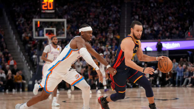 Jan 29, 2025; San Francisco, California, USA; Golden State Warriors guard Stephen Curry (30) dribbles past Oklahoma City Thunder guard Shai Gilgeous-Alexander (2) in the third quarter at the Chase Center. Mandatory Credit: Cary Edmondson-Imagn Images  