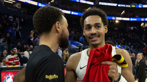 Golden State Warriors guard Stephen Curry (left) greets former teammate Washington Wizards guard Jordan Poole following their game at Chase Center. Mandatory Credit: D. Ross Cameron-Imagn Images