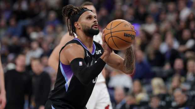 Utah Jazz guard Patty Mills (8) shoots a technical free-throw against the Miami Heat during the second half at Delta Center.