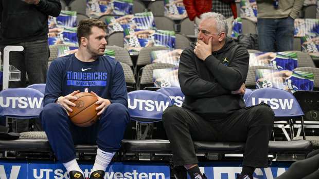 Dallas Mavericks guard Luka Doncic (left) talks with his father Sasa Doncic (right) before the game between the Dallas Mavericks and the Washington Wizards at the American Airlines Center. Mandatory Credit: Jerome Miron-Imagn Images