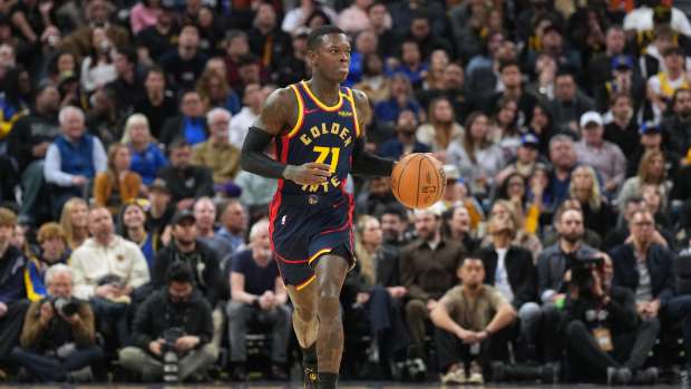 San Francisco, California, USA; Golden State Warriors guard Dennis Schroder (71) dribbles against the Los Angeles Lakers during the third quarter at Chase Center. Mandatory Credit: Darren Yamashita-Imagn Images